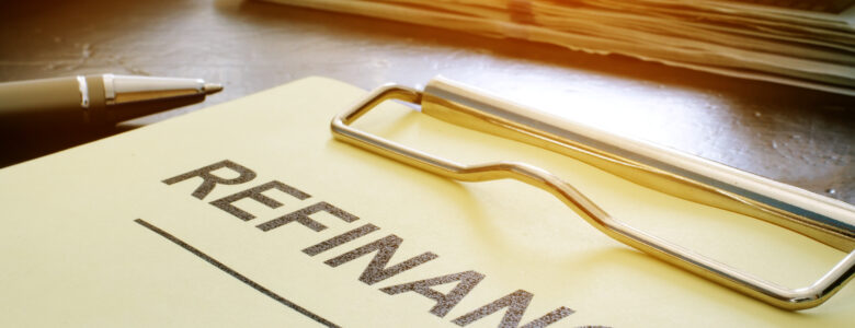 A document with the word "Refinance" highlighted, symbolizing mortgage refinancing options and benefits.